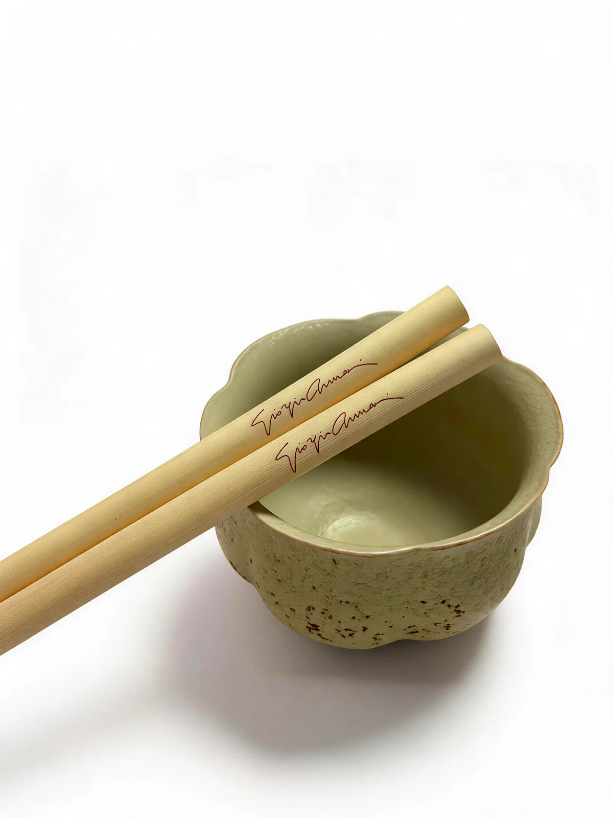 Custom signed reed straws over ceramic cup